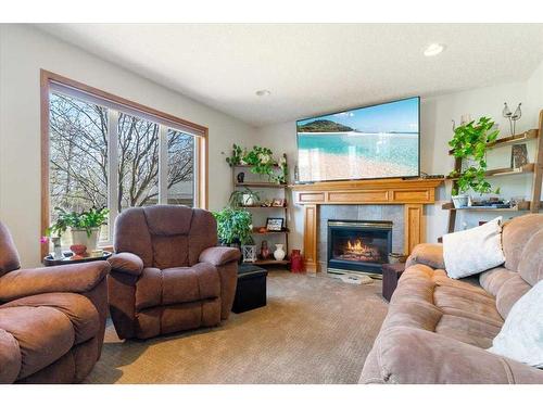 7413 102 Street, Grande Prairie, AB - Indoor Photo Showing Living Room With Fireplace