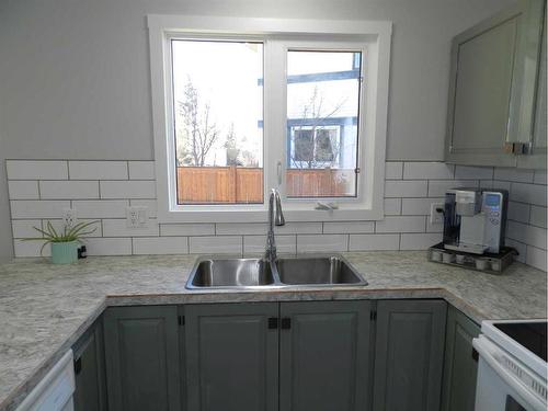 10022 84 Street, Peace River, AB - Indoor Photo Showing Kitchen With Double Sink