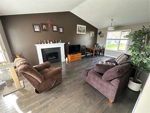 10010 85 Street, Peace River, AB - Indoor Photo Showing Living Room With Fireplace