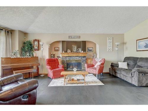 11813 Crystal Lake Drive, Grande Prairie, AB - Indoor Photo Showing Living Room With Fireplace