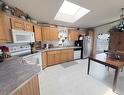 12217 98 Street, Grande Prairie, AB  - Indoor Photo Showing Kitchen With Double Sink 