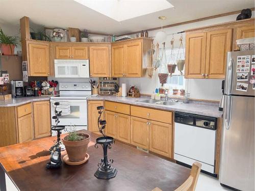 12217 98 Street, Grande Prairie, AB - Indoor Photo Showing Kitchen With Double Sink