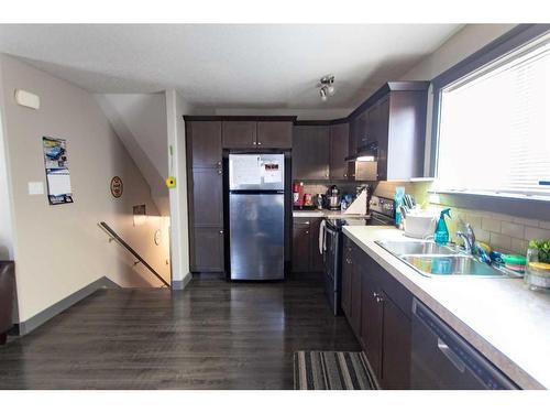 7301 115B Street, Grande Prairie, AB - Indoor Photo Showing Kitchen With Double Sink