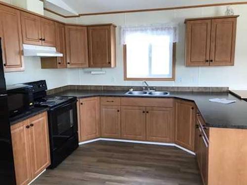 4718 49 Street, Berwyn, AB - Indoor Photo Showing Kitchen With Double Sink