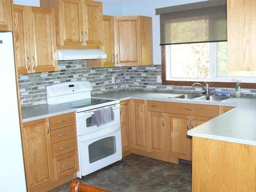 4708 54 Avenue, High Prairie, AB - Indoor Photo Showing Kitchen With Double Sink