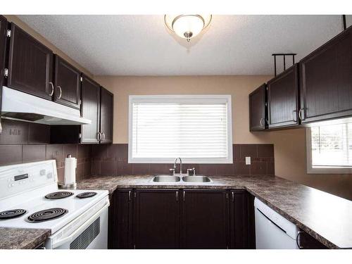 7901 Poplar Drive, Grande Prairie, AB - Indoor Photo Showing Kitchen With Double Sink