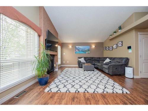 9886 67 Avenue, Grande Prairie, AB - Indoor Photo Showing Living Room With Fireplace