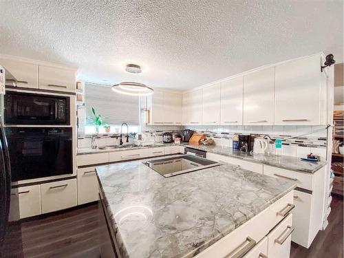 4626 50 Street, Rycroft, AB - Indoor Photo Showing Kitchen With Double Sink