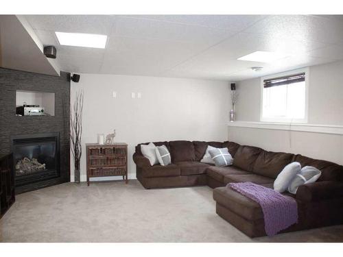 8625 102 Avenue, Grande Prairie, AB - Indoor Photo Showing Living Room With Fireplace