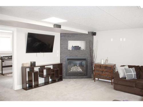 8625 102 Avenue, Grande Prairie, AB - Indoor Photo Showing Living Room With Fireplace