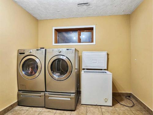 11034 Hoppe Avenue, Grande Cache, AB - Indoor Photo Showing Laundry Room