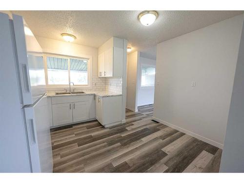 9737 117 Avenue, Grande Prairie, AB - Indoor Photo Showing Kitchen With Double Sink