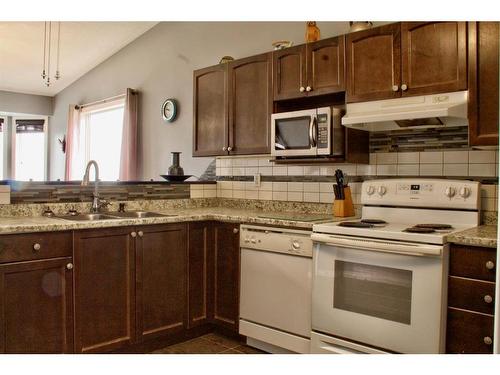 10118 98A Street, Sexsmith, AB - Indoor Photo Showing Kitchen With Double Sink