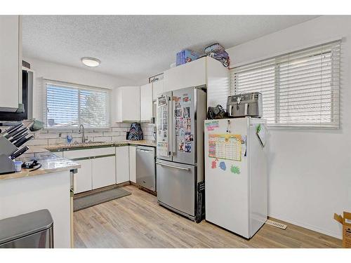 6407 94 Street, Grande Prairie, AB - Indoor Photo Showing Kitchen With Double Sink