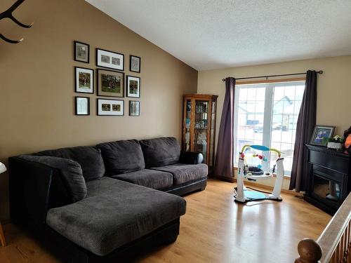 4508 47 Street, Grimshaw, AB - Indoor Photo Showing Living Room With Fireplace
