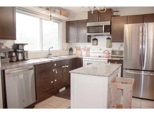 7727 95 Street, Grande Prairie, AB - Indoor Photo Showing Kitchen With Double Sink