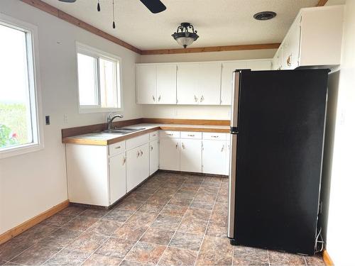 45063A 734 Township, Rural Grande Prairie No. 1, County Of, AB - Indoor Photo Showing Kitchen With Double Sink