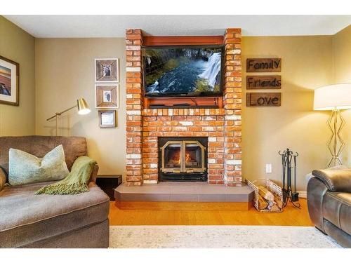 9518 62 Avenue, Grande Prairie, AB - Indoor Photo Showing Living Room With Fireplace