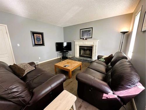 9359 66 Avenue, Grande Prairie, AB - Indoor Photo Showing Living Room With Fireplace