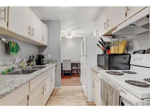 108-9260 108 Avenue, Grande Prairie, AB - Indoor Photo Showing Kitchen With Double Sink