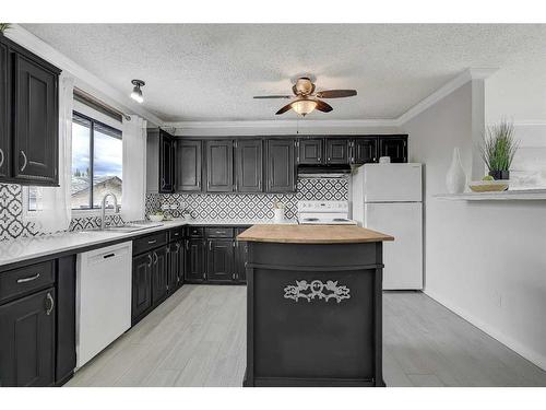 9634 83 Avenue, Grande Prairie, AB - Indoor Photo Showing Kitchen With Double Sink