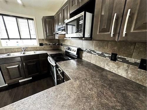 12721 105 Street, Grande Prairie, AB - Indoor Photo Showing Kitchen With Double Sink