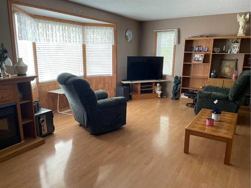 10929 114 Street, Fairview, AB - Indoor Photo Showing Living Room With Fireplace