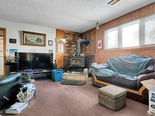 10621 105 Ave, Grande Cache, AB - Indoor Photo Showing Living Room With Fireplace