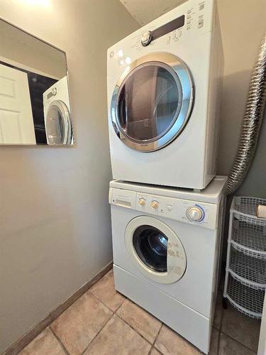 9806 104 Street, Grande Cache, AB - Indoor Photo Showing Laundry Room