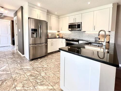 9814 75 Avenue, Grande Prairie, AB - Indoor Photo Showing Kitchen With Stainless Steel Kitchen With Upgraded Kitchen