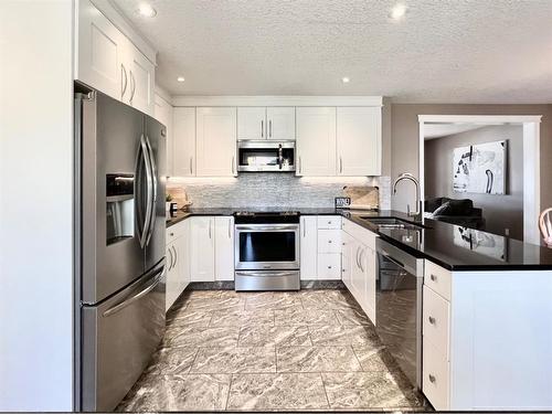 9814 75 Avenue, Grande Prairie, AB - Indoor Photo Showing Kitchen With Stainless Steel Kitchen With Upgraded Kitchen
