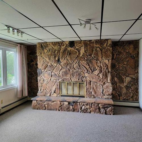 11719 103 Street, Peace River, AB - Indoor With Fireplace