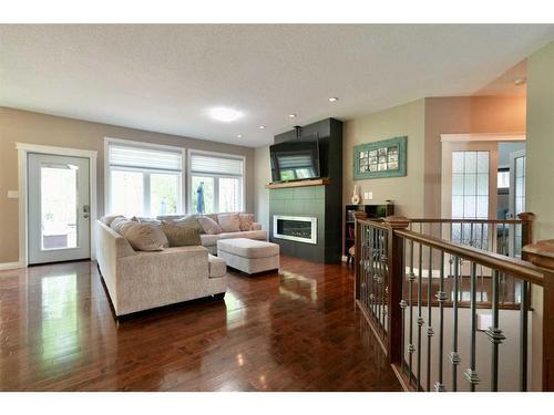 844007 Range Road 222, Rural Northern Lights, County Of, AB - Indoor Photo Showing Living Room With Fireplace