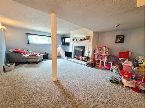 7529 96 Street, Peace River, AB - Indoor With Fireplace