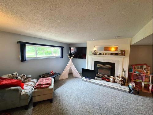 7529 96 Street, Peace River, AB - Indoor With Fireplace