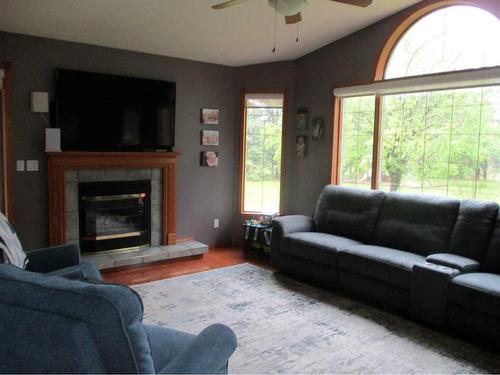 220037-692 Road East, Rural Northern Lights, County Of, AB - Indoor Photo Showing Living Room With Fireplace