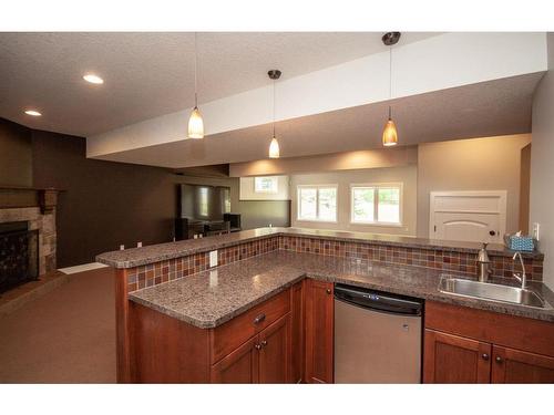 30-705033 Road 65 Range, Rural Grande Prairie No. 1, County Of, AB - Indoor Photo Showing Kitchen With Fireplace
