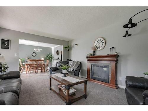 850037 Highway 743, Rural Northern Lights, County Of, AB - Indoor Photo Showing Living Room With Fireplace