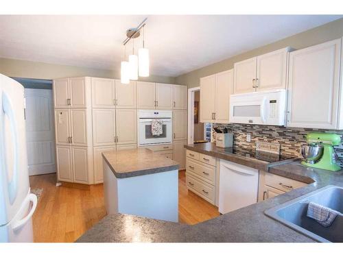 6121 96 Street, Grande Prairie, AB - Indoor Photo Showing Kitchen With Double Sink