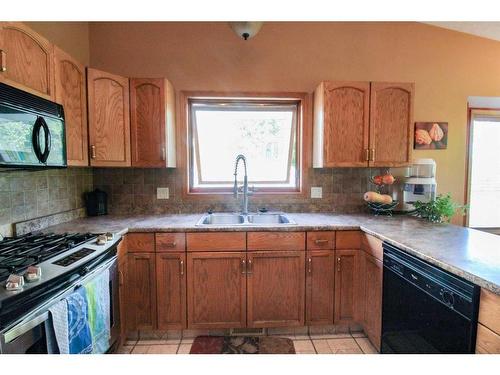8133 106A Street, Grande Prairie, AB - Indoor Photo Showing Kitchen With Double Sink