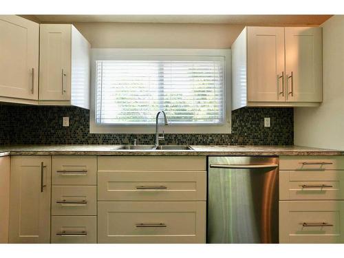 8218 96 Street, Peace River, AB - Indoor Photo Showing Kitchen With Double Sink