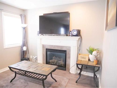 10606 128 Avenue, Grande Prairie, AB - Indoor Photo Showing Living Room With Fireplace