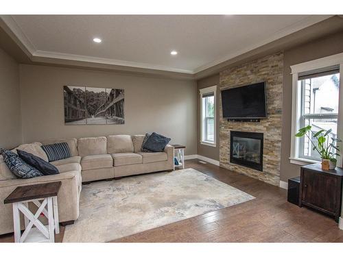 8822 87 Avenue, Grande Prairie, AB - Indoor Photo Showing Living Room With Fireplace