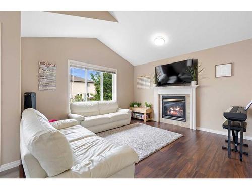 117 Pinnacle Avenue, Grande Prairie, AB - Indoor Photo Showing Living Room With Fireplace
