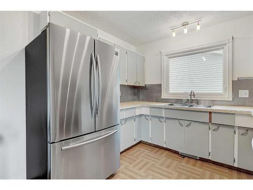 11802 96 Street, Grande Prairie, AB - Indoor Photo Showing Kitchen With Double Sink