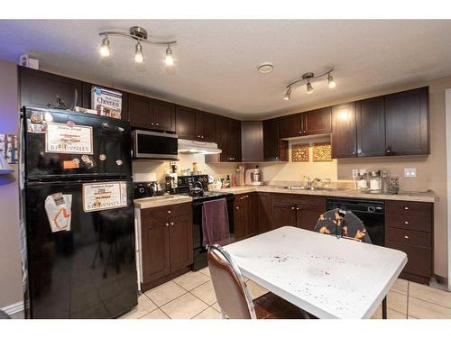 A/B-8918 71 Avenue, Grande Prairie, AB - Indoor Photo Showing Kitchen With Double Sink