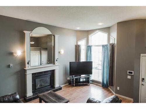 7122 90 Street, Grande Prairie, AB - Indoor Photo Showing Living Room With Fireplace