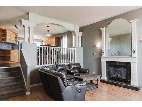 7122 90 Street, Grande Prairie, AB - Indoor Photo Showing Living Room With Fireplace