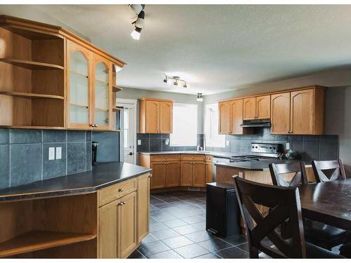 7122 90 Street, Grande Prairie, AB - Indoor Photo Showing Kitchen With Double Sink