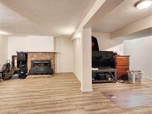 9817 102 Street, Grande Cache, AB - Indoor Photo Showing Living Room With Fireplace